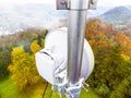 Microwave link transmission antenna dish on a telecommunication cellular network metal tower