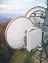 Microwave link transmission antenna dish on a telecommunication cellular network metal tower