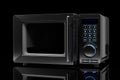 Microwave oven on a black background Royalty Free Stock Photo