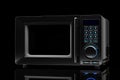 Microwave oven on a black background Royalty Free Stock Photo