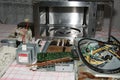 Microwave oven disassembled on a kitchen table