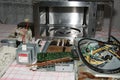 Microwave oven disassembled on a kitchen table Royalty Free Stock Photo