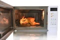 The microwave oven is warm chicken spaghetti. Royalty Free Stock Photo