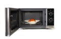 The microwave oven is warm chicken spaghetti. Royalty Free Stock Photo