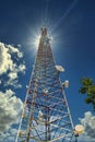 Microwave Tower Rising Into Sun Royalty Free Stock Photo