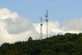 Microwave Towers and Cumulus Clouds Royalty Free Stock Photo