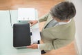 Mid-adult businessman using photocopy machine Royalty Free Stock Photo