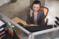 Mid adult businesswoman on the phone in the office Royalty Free Stock Photo