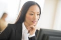 Mid Adult Businesswoman Working On Computer In Office