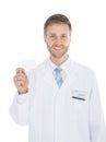 Mid Adult Doctor Holding Blank Visiting Card