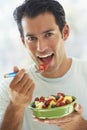 Mid Adult Man Eating Fresh Fruit Salad Royalty Free Stock Photo