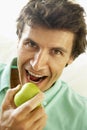 Mid Adult Man Eating A Healthy Apple