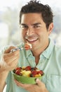 Mid Adult Man Holding A Bowl Of Fresh Fruit Salad Royalty Free Stock Photo