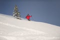 Mid adult man skiing down steep hill Royalty Free Stock Photo