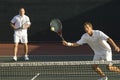 Mid Adult Men Playing Tennis Royalty Free Stock Photo