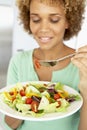 Mid Adult Woman Eating A Healthy Salad Royalty Free Stock Photo