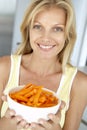 Mid Adult Woman Holding A Plate Of Carrots Royalty Free Stock Photo