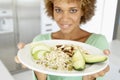 Mid Adult Woman Holding A Plate With Healthy Food Royalty Free Stock Photo