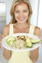 Mid Adult Woman Holding Plate With Healthy Foods Royalty Free Stock Photo
