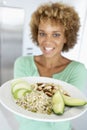 Mid Adult Woman Holding Plate With Healthy Foods