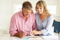 Mid age couple painting with watercolors Royalty Free Stock Photo