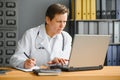 Mid age female doctor writing prescription Royalty Free Stock Photo