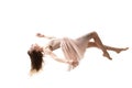 Mid-air beauty. Full length studio shot of attractive young woman hovering in air and keeping eyes closed