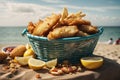 mid angle shot of a plate of fish and chips served in a basket, beach-side