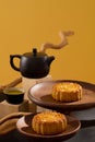Mid-autumn festival celebration with delightful mooncakes displayed on few round-shaped dishes