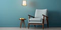 Mid-century armchair and floor lamp near light blue wall. Interior design of modern living room