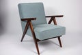 mid-century armchair with plush upholstery and angular design