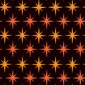 Mid century Modern Atomic starburst in orange and amber orange over dark background