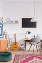 Mid century unisex room with vintage furniture for a creative student Royalty Free Stock Photo