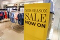 Mid season sales promotion on retail shop entrance Royalty Free Stock Photo