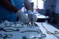 Surgeon arranging surgical instrument in operating room of hospital Royalty Free Stock Photo