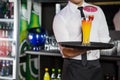 Mid section of bartender serving cocktail Royalty Free Stock Photo