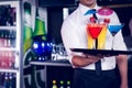 Mid section of bartender serving cocktail and martini Royalty Free Stock Photo