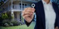 Composite image of mid section of businesswoman showing new house key