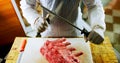 Butcher sharping knife in shop 4k