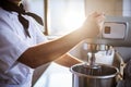 Mid section of chef blending the batter in mixing blender Royalty Free Stock Photo