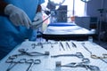 Surgeon holding surgical instrument in operating room of hospital Royalty Free Stock Photo