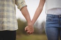 Mid section of couple holding hands at farm Royalty Free Stock Photo