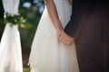 Mid section of couple holding hands Royalty Free Stock Photo