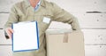 Mid section of delivery man with box and clipboard Royalty Free Stock Photo