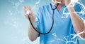 Mid section of doctor examining with stethoscope Royalty Free Stock Photo