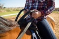 Mid section of girl riding a horse in the ranch Royalty Free Stock Photo