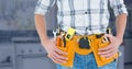 Mid-section of handy man with tool belt Royalty Free Stock Photo