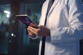 Mid section of male doctor using digital tablet in corridor at medical office, Doctor holding a digital tablet in the meeting room Royalty Free Stock Photo