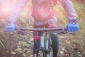 Mid section of male mountain biker riding bicycle Royalty Free Stock Photo