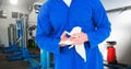 Mid section of mechanic holding napkin Royalty Free Stock Photo